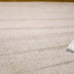 This is a photo of a carpet steam cleaner cleaning a cream carpet works carried out by Mill Hill Carpet Cleaning.