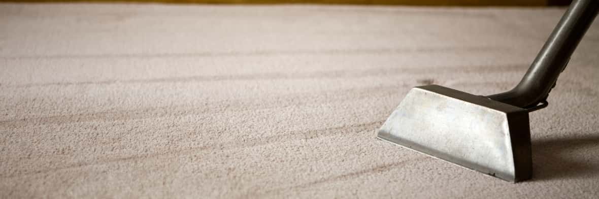 This is a photo of a carpet steam cleaner cleaning a cream carpet works carried out by Mill Hill Carpet Cleaning.