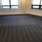 This is a photo of Mill Hill Carpet Cleaning grey office carpet that has just been professionally steam cleaned.