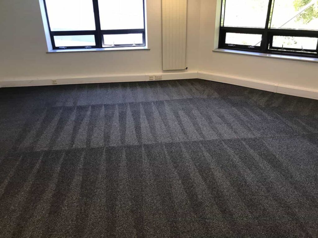 This is a photo of Mill Hill Carpet Cleaning grey office carpet that has just been professionally steam cleaned.